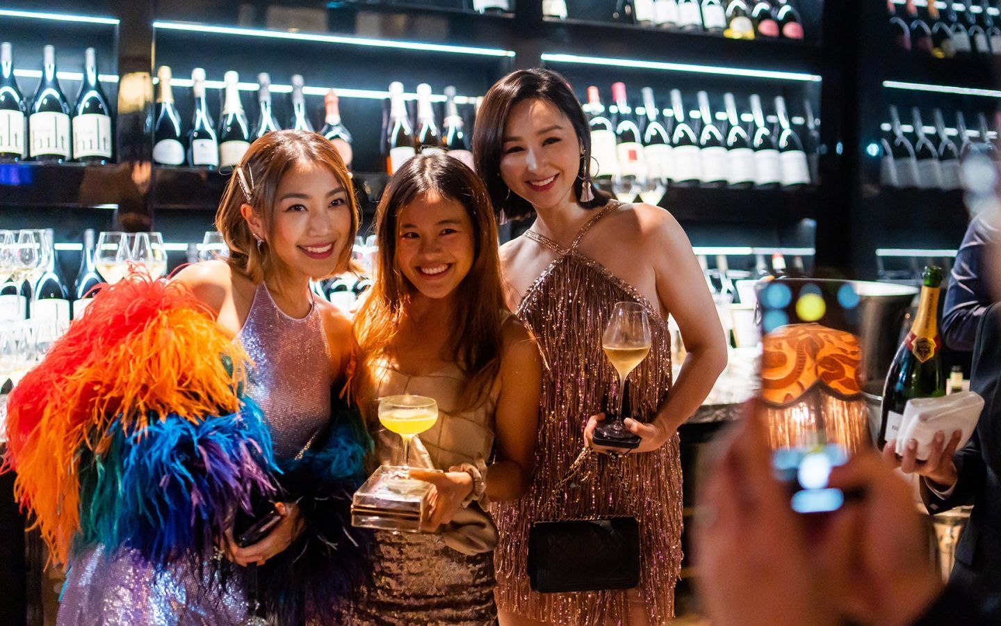 Guests pose with glasses at 40 Under 40 2022
