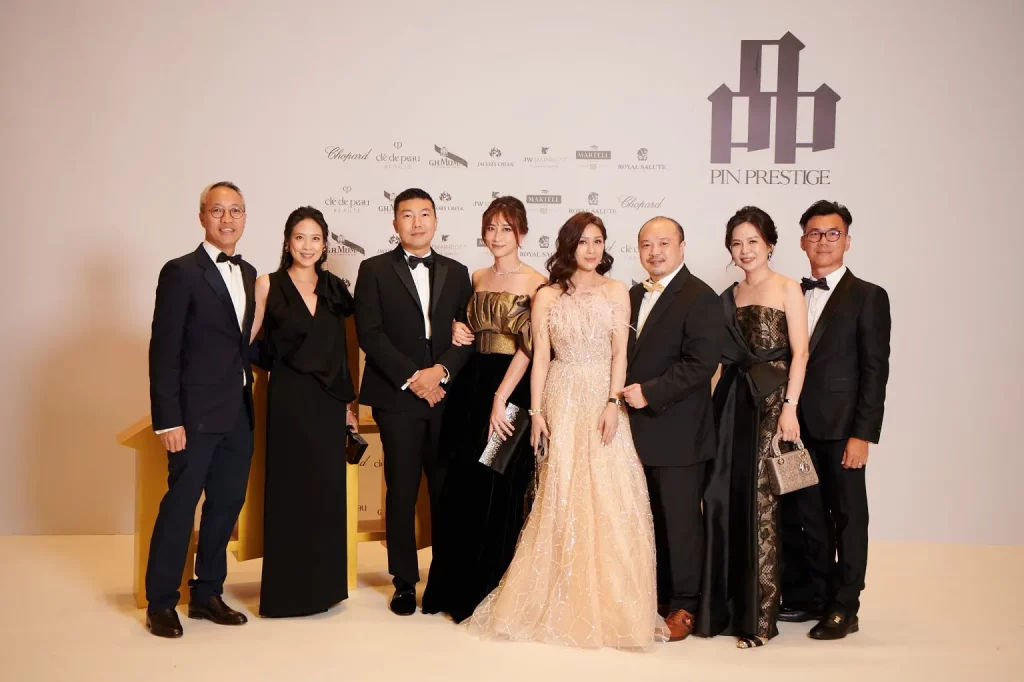 Guests pose with main backdrop