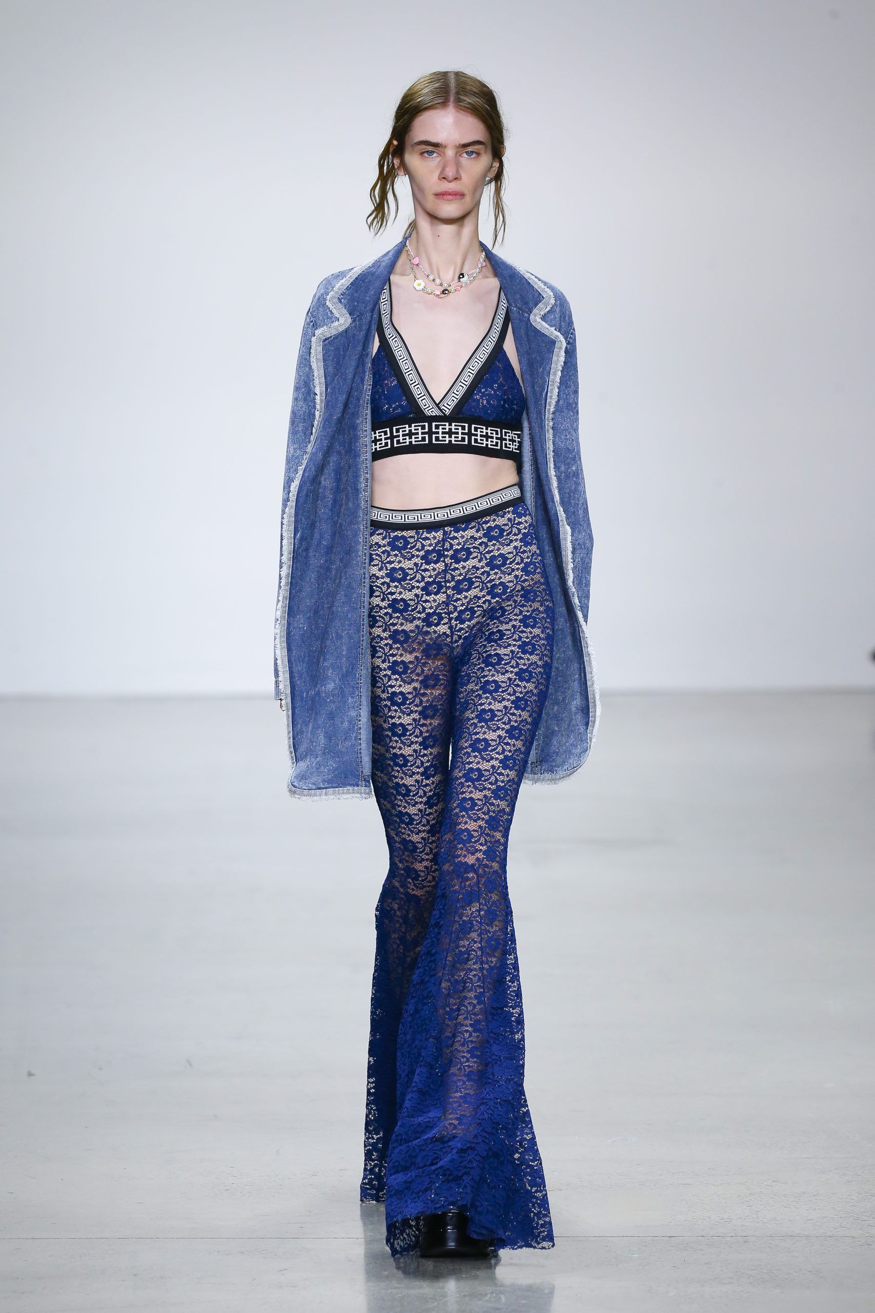Female model with blue jacket and trousers at Metaverse, Past, Present, and Future SS23 show at New York Fashion Week