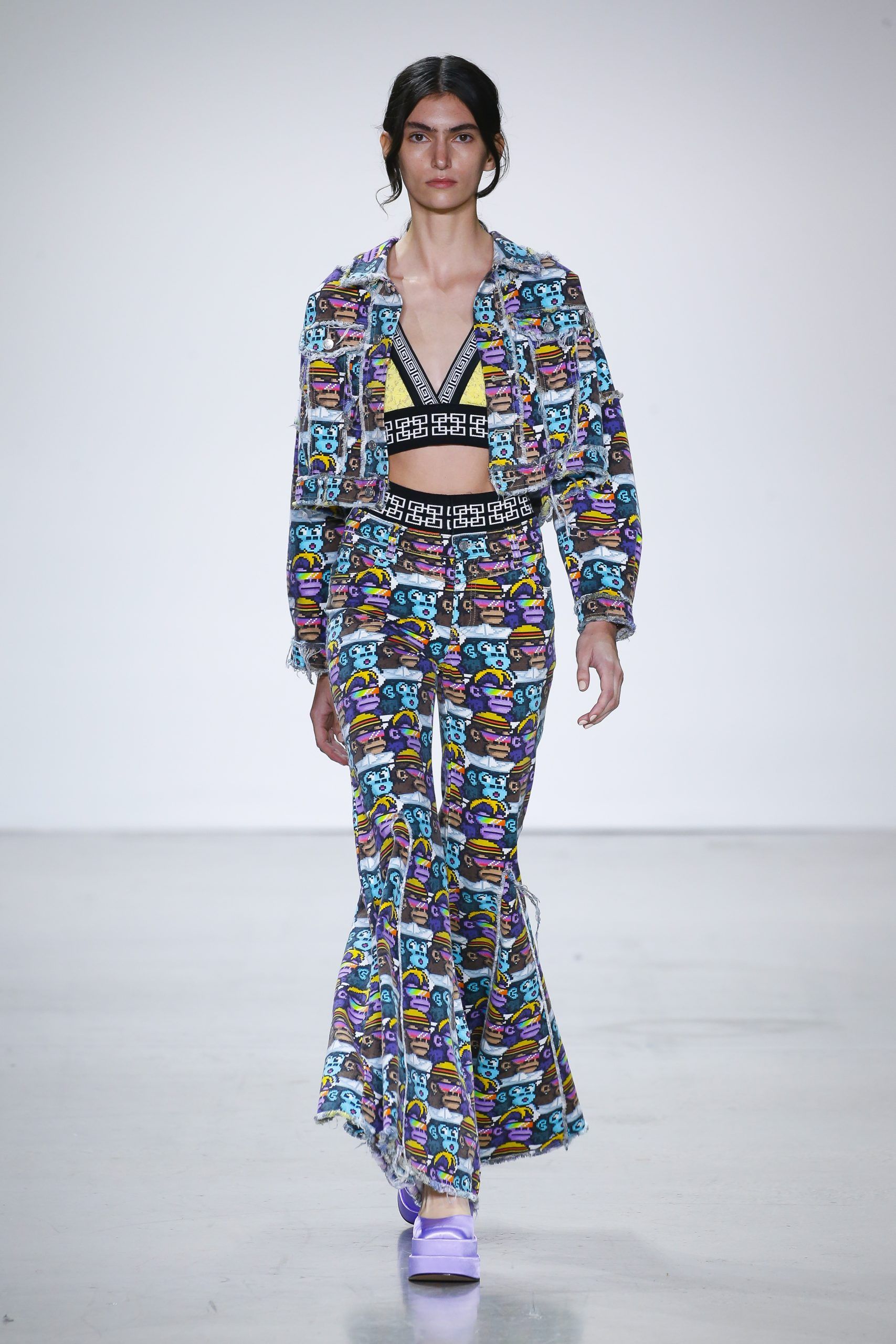 Female model with printed jacket and trousers at Metaverse, Past, Present, and Future SS23 show at New York Fashion Week