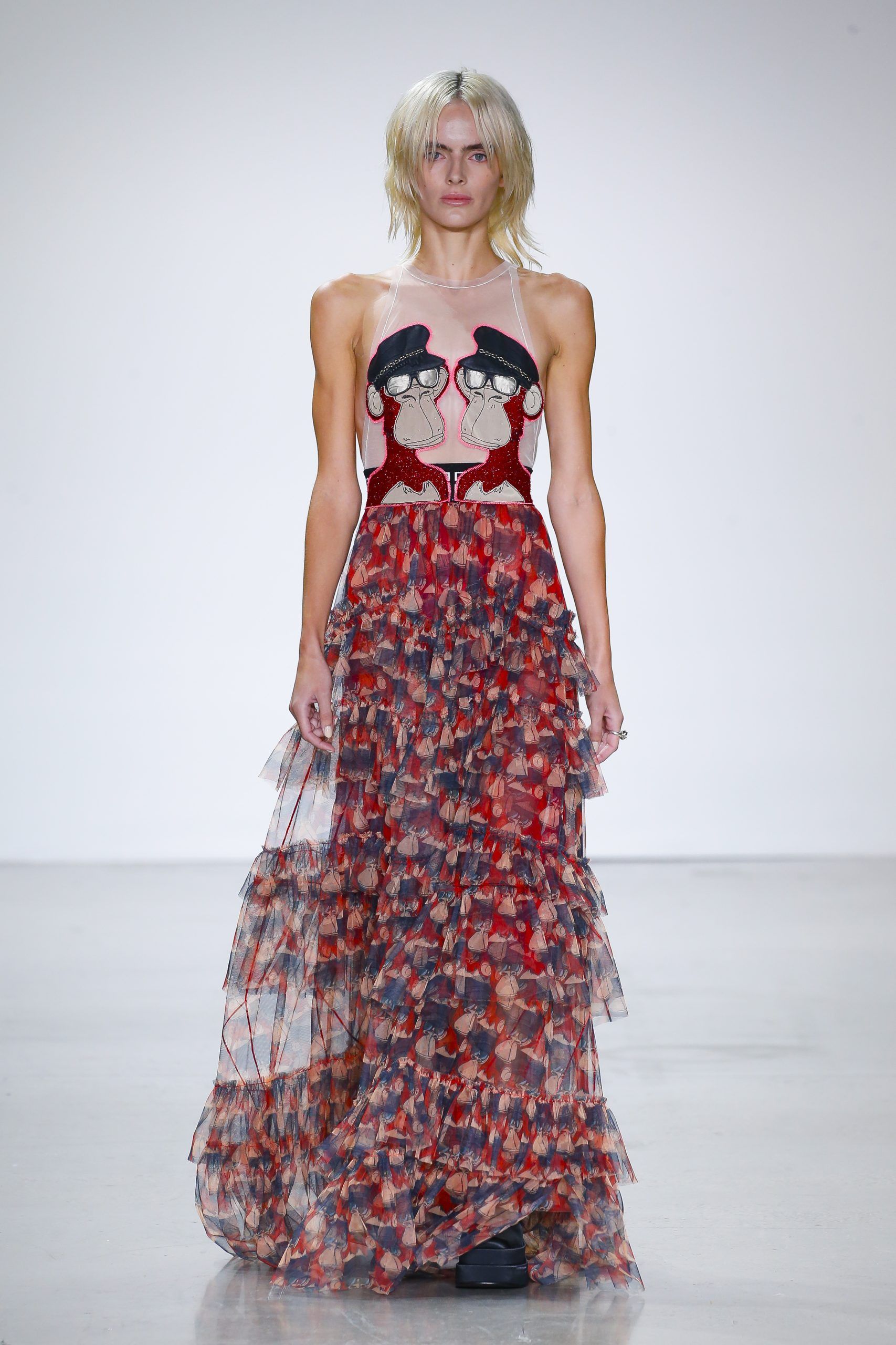 Model wearing long red skirt at Vivienne Tam’s Metaverse, Past, Present, and Future SS23 show at New York Fashion Week