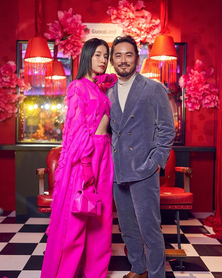 Guests pose with the GuocoLand Hair Salon backdrop at PINCNY2023 event